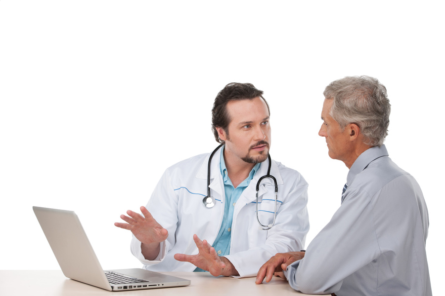 Doctor having a discussion with a male patient.